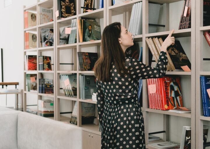 University student looking at books